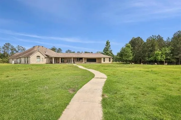 a front view of a house with yard