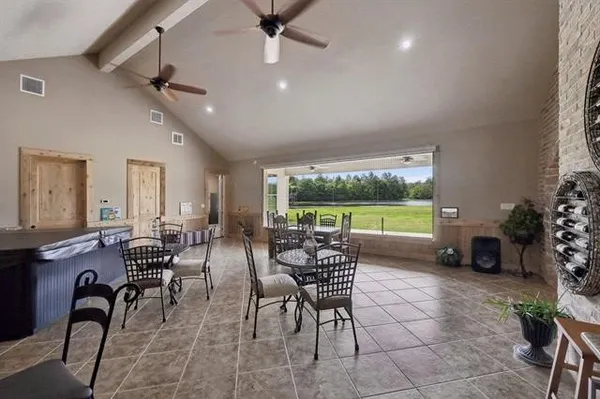a view of a dining room with furniture window and outside view