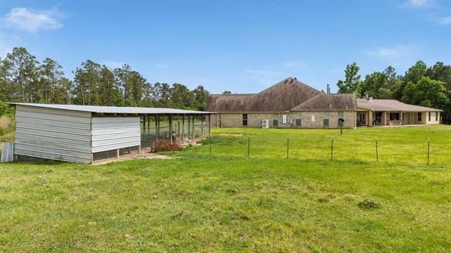 2014 Fish Lake Road Kountze, TX 77625 - Photo 29 of 35 a view of a house with a yard