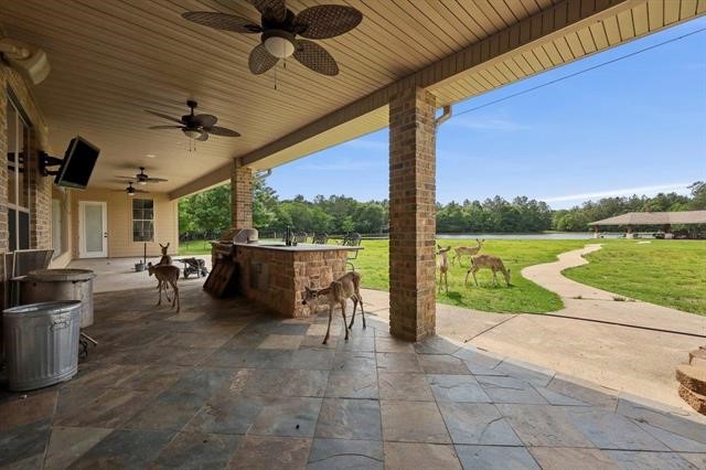 2014 Fish Lake Road Kountze, TX 77625 - Photo 30 of 35 a view of a porch with furniture and a yard