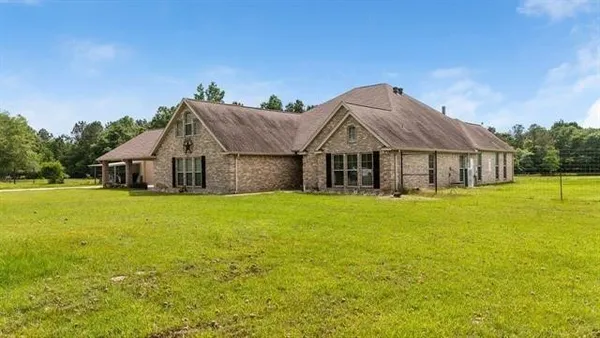 a front view of a house with yard