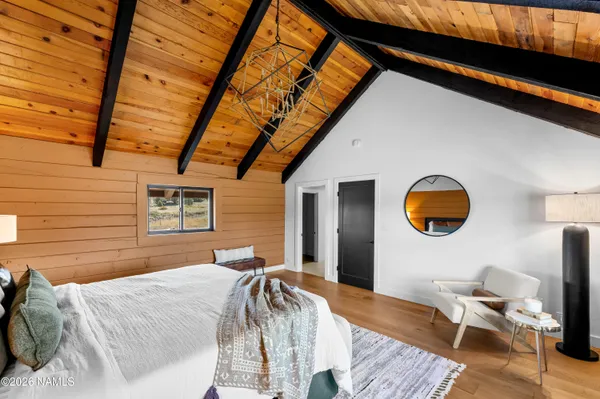 a bedroom with a bed and a chair