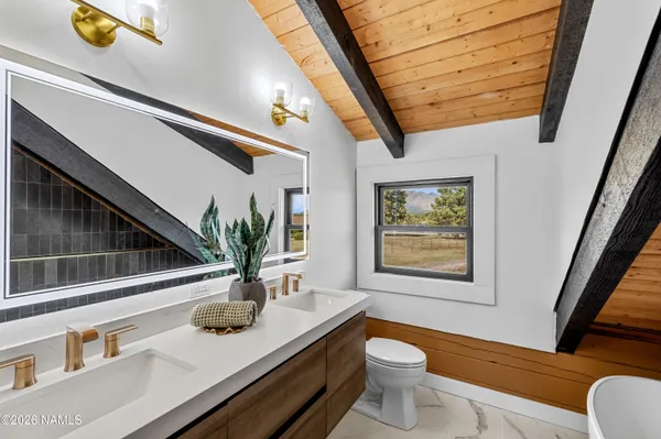 a bathroom with a tub and sink