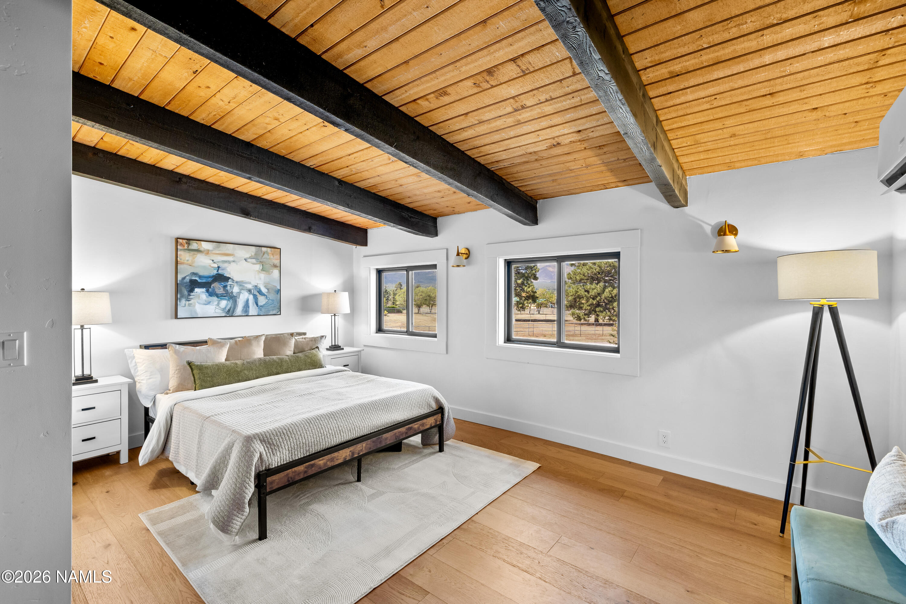 8191 June Lane Flagstaff, AZ 86004 - Photo 39 of 45 a bedroom with a bed and a large window