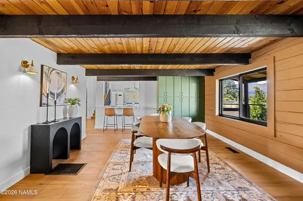 a dining room with furniture and window