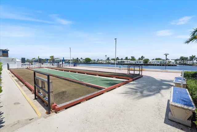 a view of a swimming pool with a yard