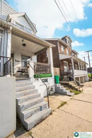 a view of a building with sitting area