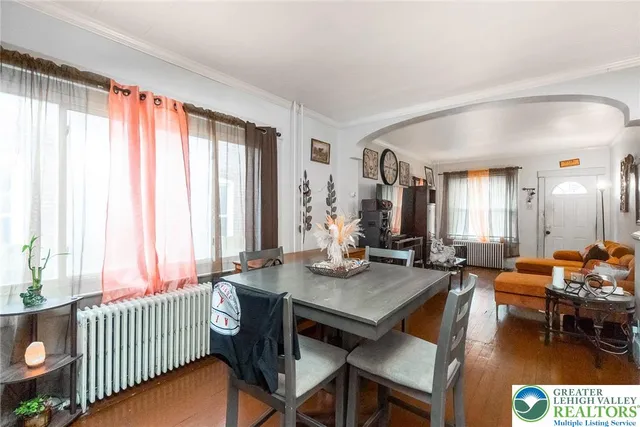 a view of a dining room with furniture and window