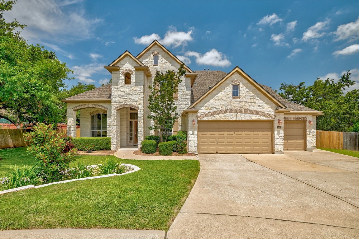 303 Jeffrey Drive Cedar Park, TX 78613 - Photo 1 of 1 a front view of a house with a yard and garage