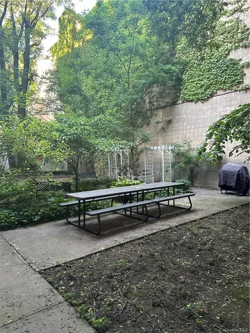 a view of a bench in a backyard