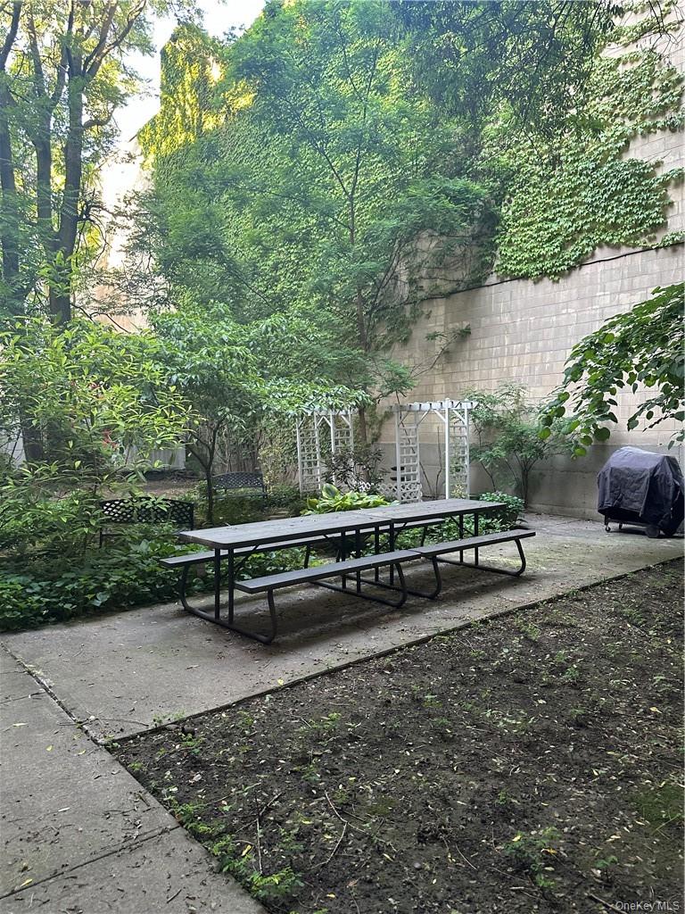 145-149 Morningside Avenue, Unit 2C Manhattan, NY 10027 - Photo 10 of 12 a view of a bench in a backyard