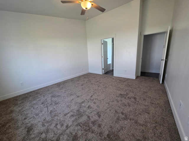 1237 West 3440 South Logan, UT 84321 - Photo 17 of 29 Spacious bedroom with neutral wall finishes, carpeted flooring, ceiling fan with integrated lighting, and dual closet access including a mirrored sliding door option