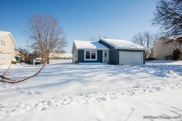 a view of a house with a snow in the yard