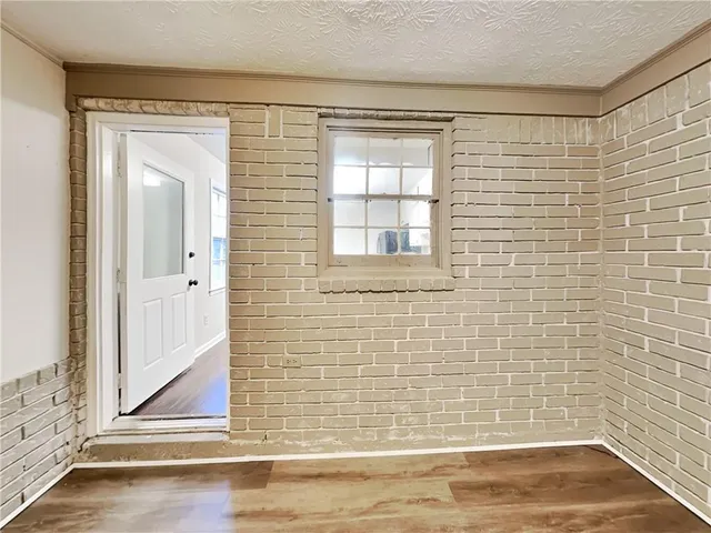 a view of a door and a window