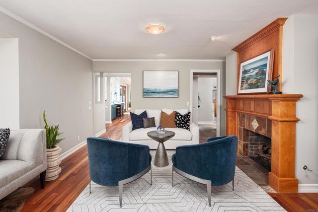 a living room with furniture flowerpot and a potted plant
