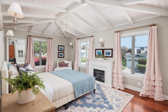 a bathroom with a granite countertop sink a toilet and a vanity