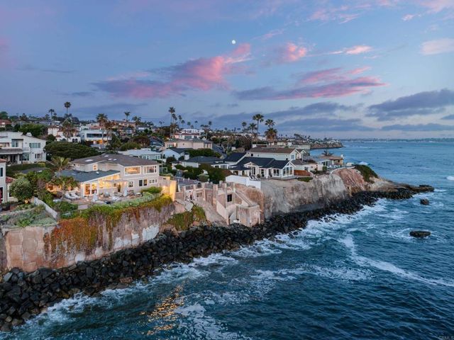 an aerial view of a house with a yard and a fountain