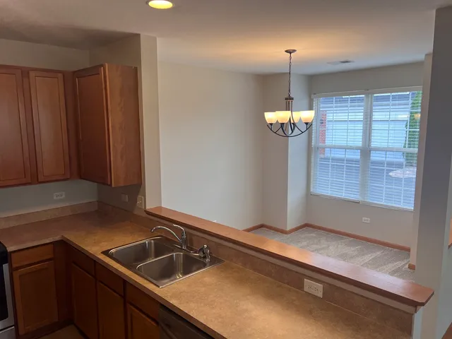 a kitchen with a sink and a window