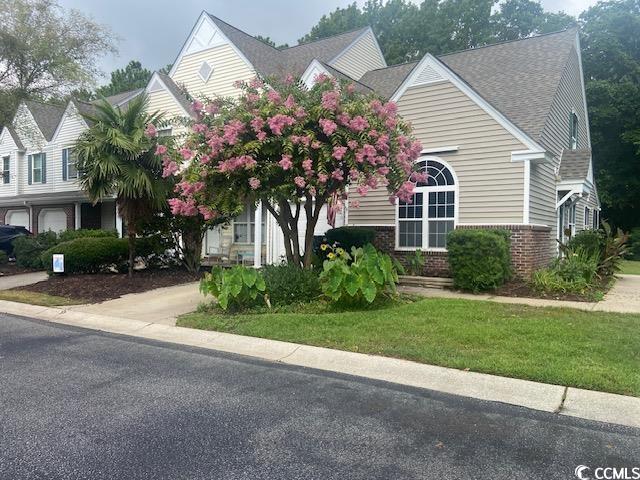 110 Palisade Loop, Unit 110 Pawleys Island, SC 29585 - Photo 1 of 23 Obstructed view of property featuring brick siding