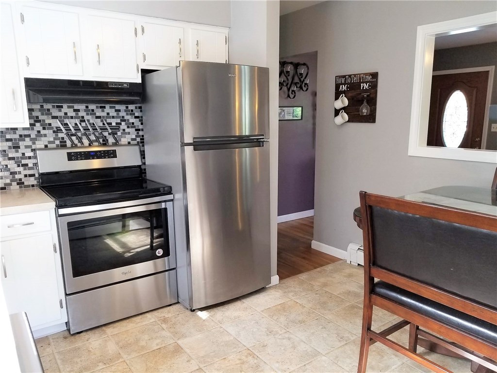 79 Restful Valley Road Tiverton, RI 02878 - Photo 3 of 18 stainless appliances and ceramic floor in eat in kitchen