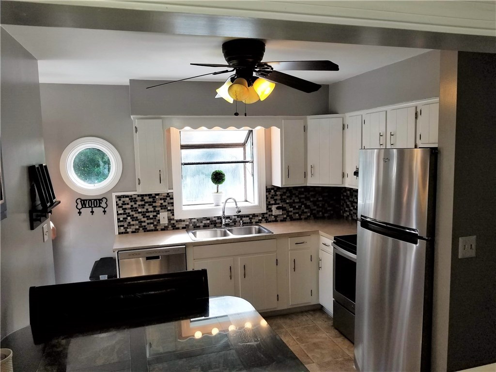 79 Restful Valley Road Tiverton, RI 02878 - Photo 4 of 18 stainless appliances and ceramic floor in eat in kitchen