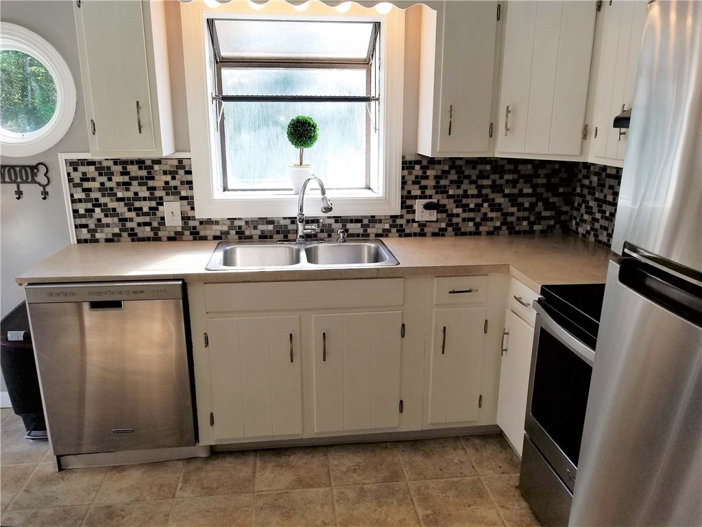 79 Restful Valley Road Tiverton, RI 02878 - Photo 5 of 18 stainless appliances and ceramic floor in eat in kitchen