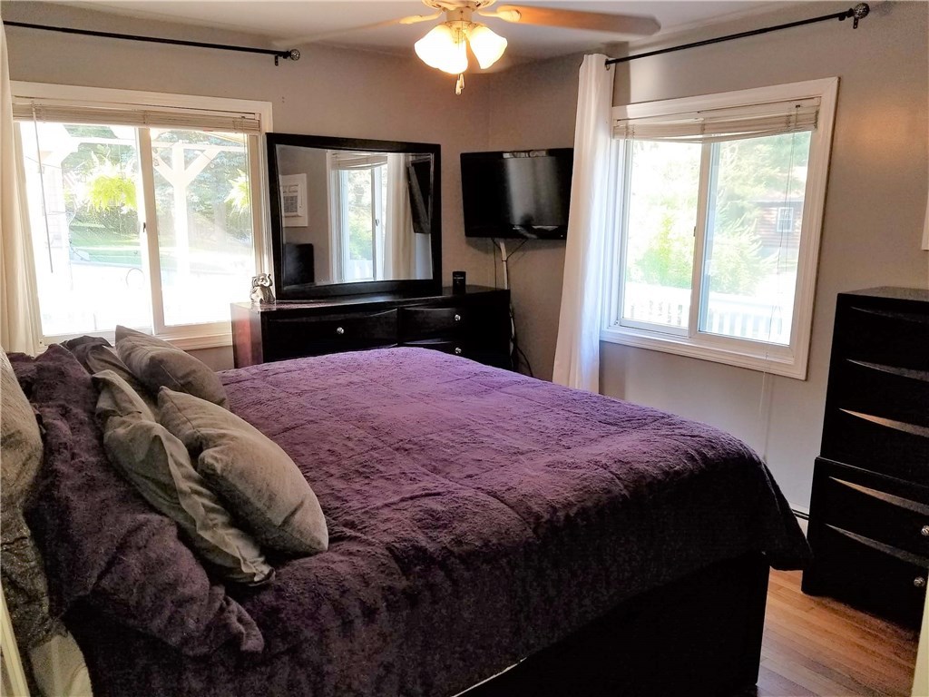79 Restful Valley Road Tiverton, RI 02878 - Photo 10 of 18 bedroom 1 with hardwood floors and built in AC unit