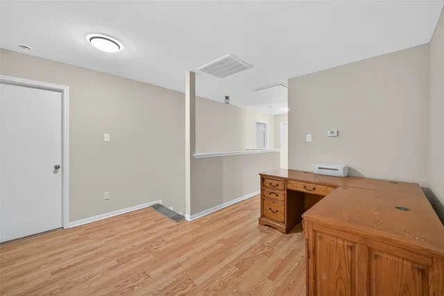 a storage room with wooden floor