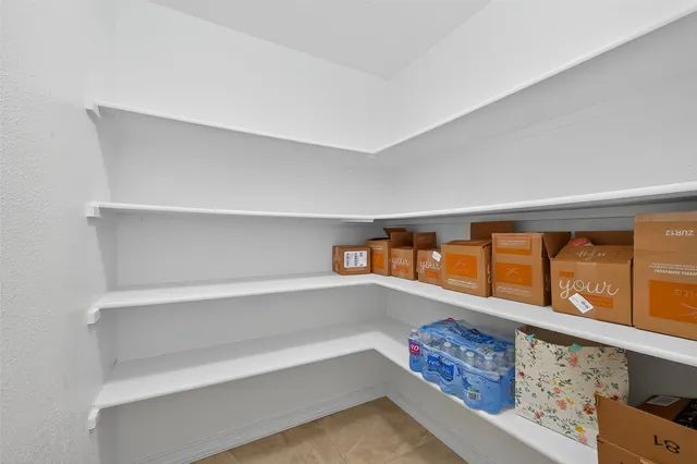 a view of an empty room with shelves