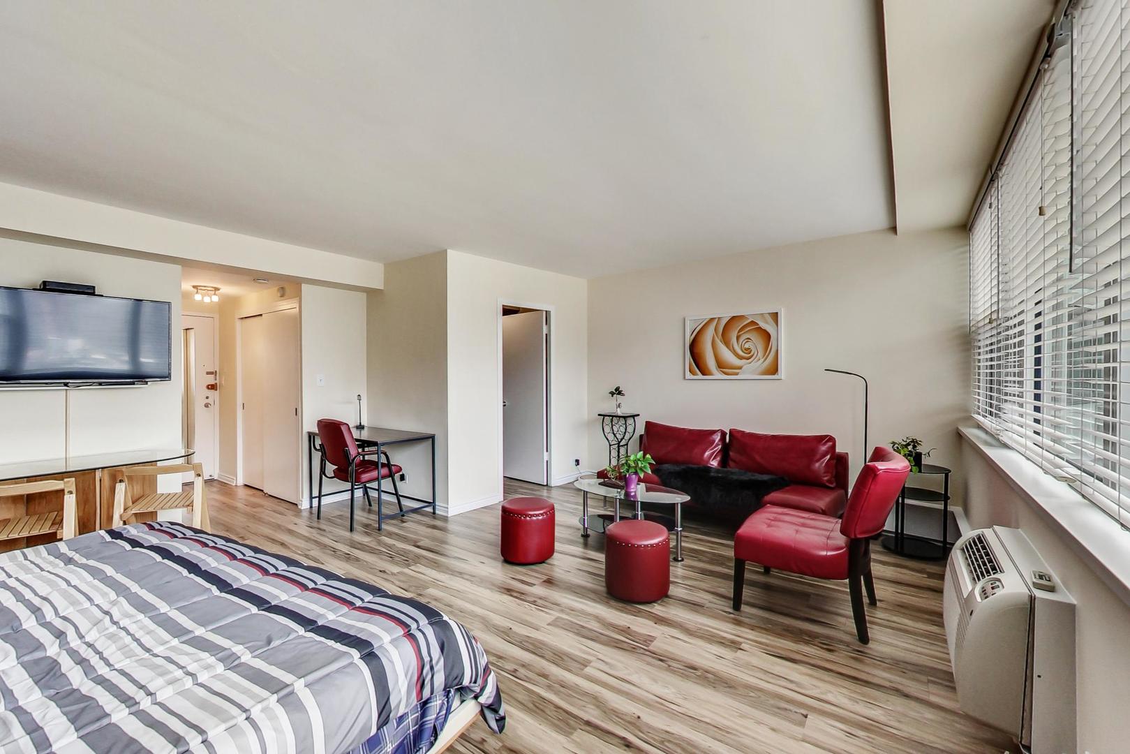 1150 North Lake Shore Drive, Unit 11J Chicago, IL 60611 - Photo 15 of 34 a bedroom with furniture and a fireplace