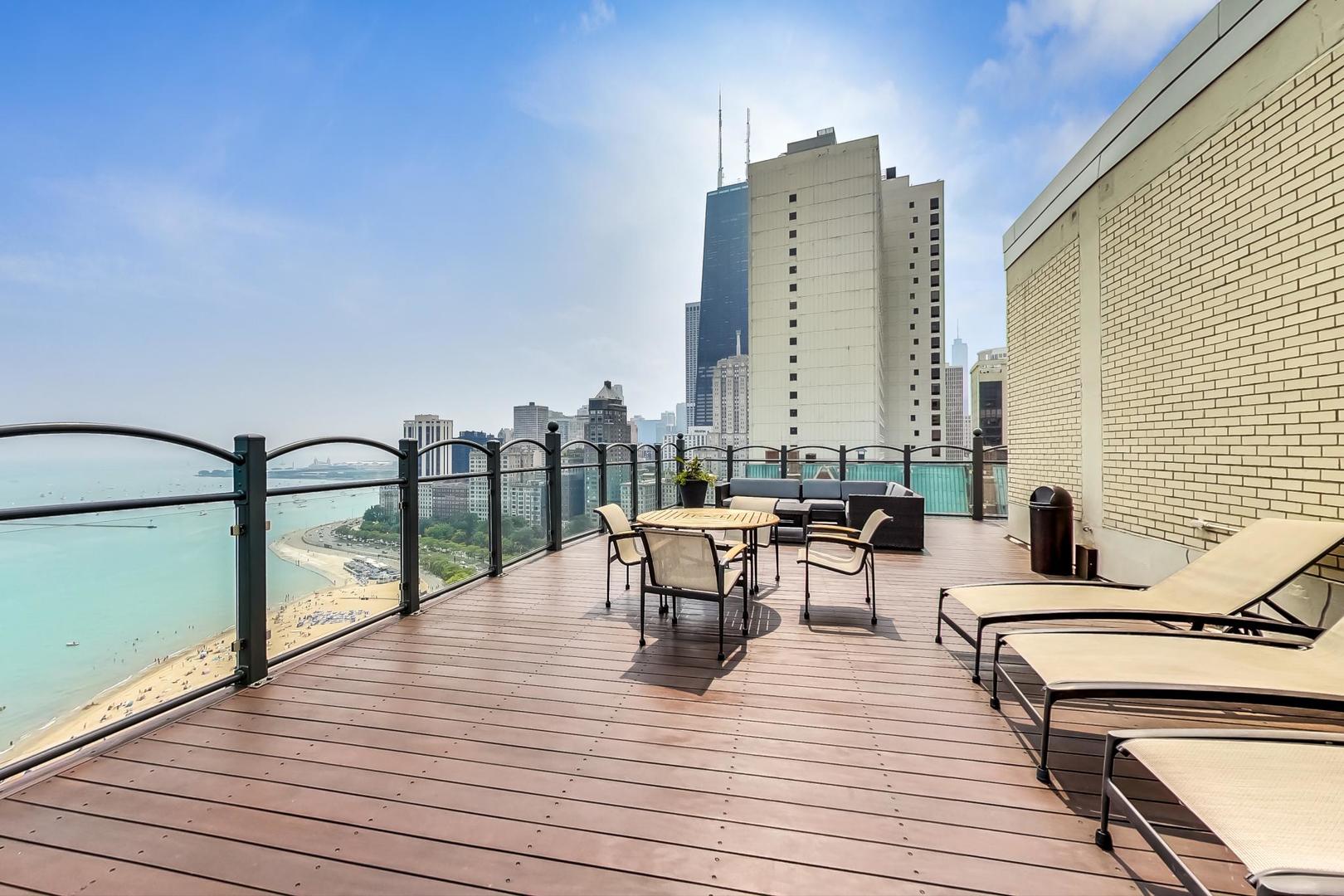 1150 North Lake Shore Drive, Unit 11J Chicago, IL 60611 - Photo 29 of 34 a view of roof deck with seating space and dining space