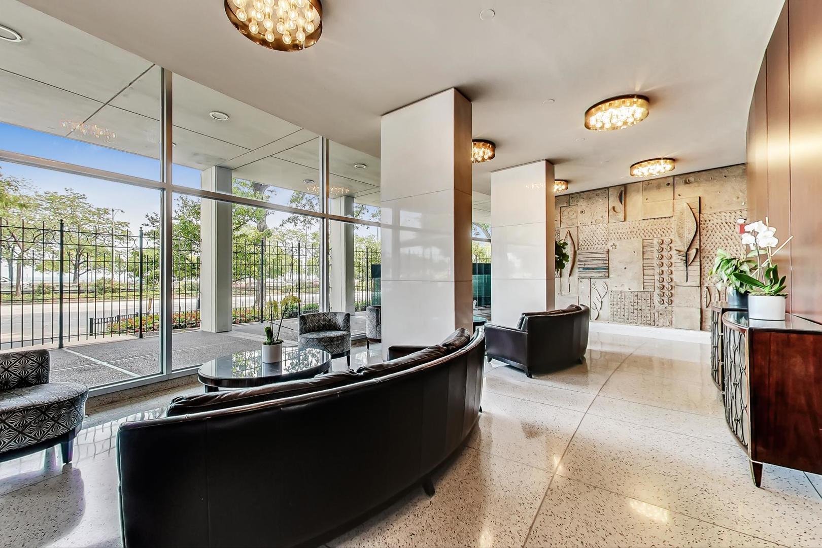 1150 North Lake Shore Drive, Unit 11J Chicago, IL 60611 - Photo 5 of 34 a room with furniture and window