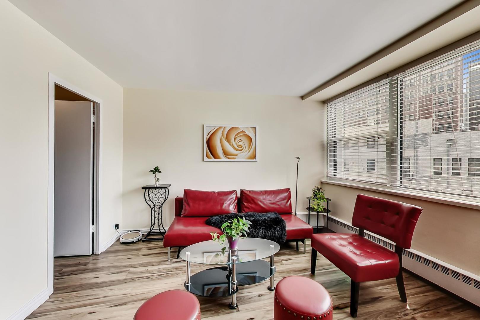 1150 North Lake Shore Drive, Unit 11J Chicago, IL 60611 - Photo 9 of 34 a living room with furniture and a large window