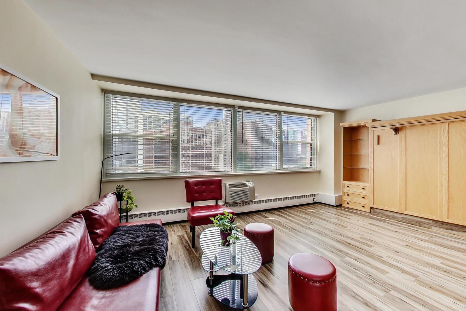 1150 North Lake Shore Drive, Unit 11J Chicago, IL 60611 - Photo 10 of 34 a living room with furniture