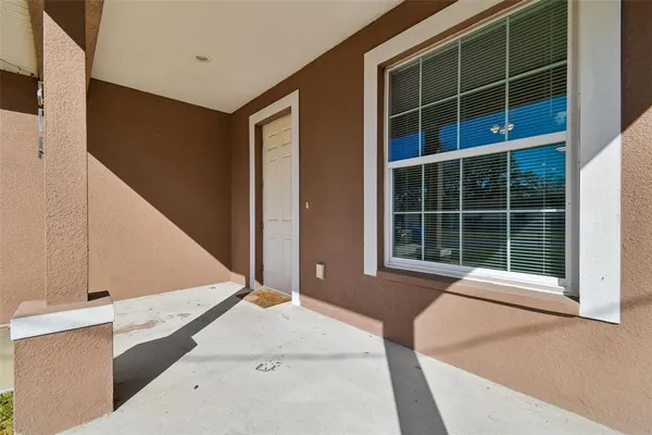 a front view of a house with a large window