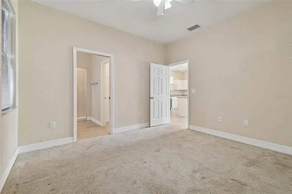 an empty room with closet area