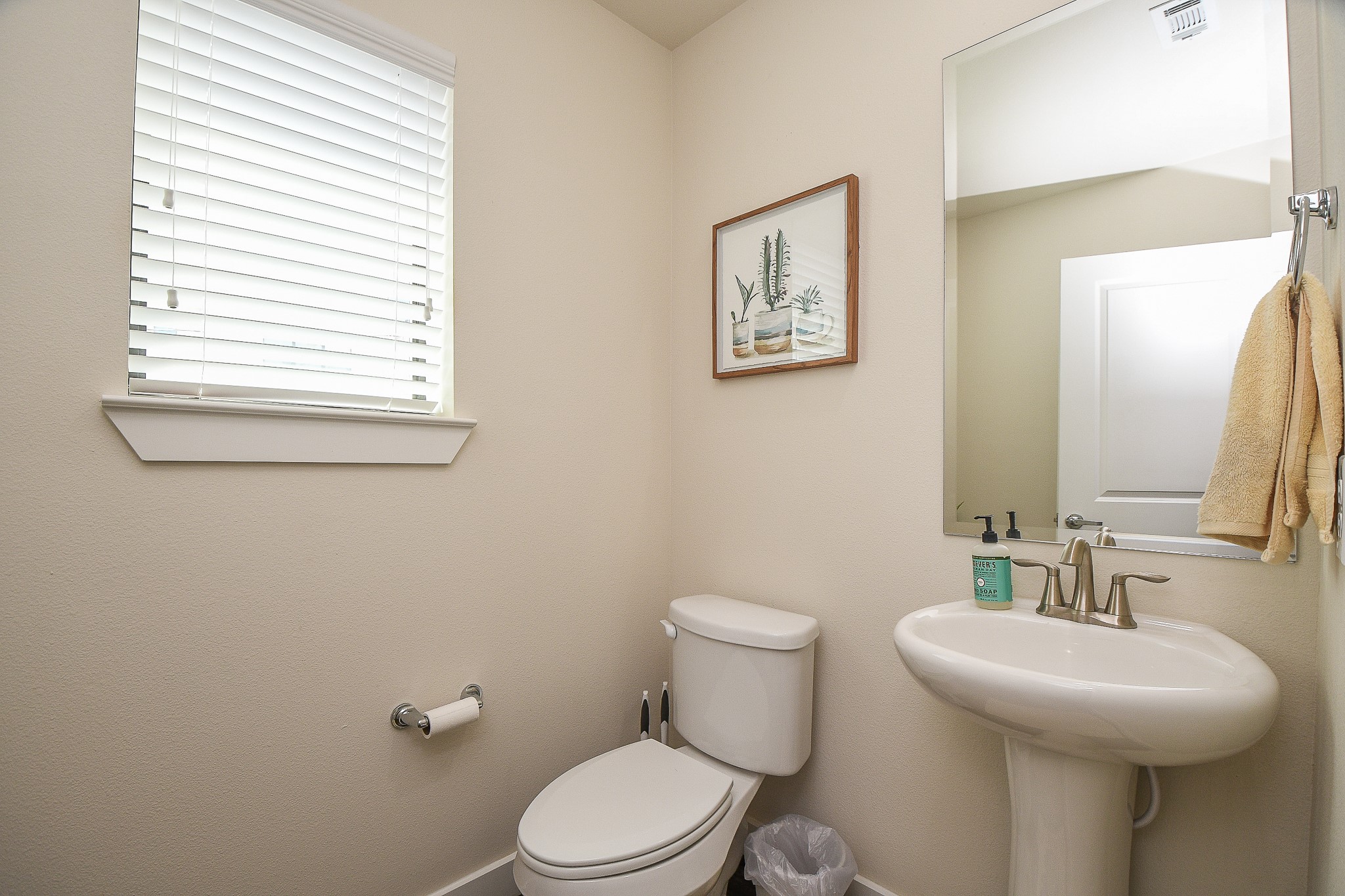 1204 Fowler Street Houston, TX 77007 - Photo 12 of 23 a bathroom with a toilet a sink and a window