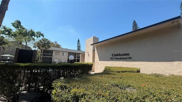 a view of swimming pool with chairs