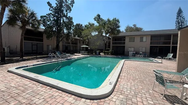 a view of a house with backyard and porch