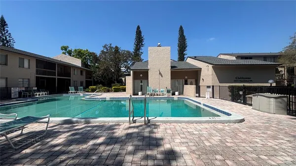 a view of a house with backyard and porch