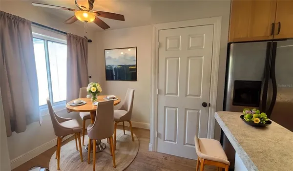 a kitchen with a sink a stove and cabinets