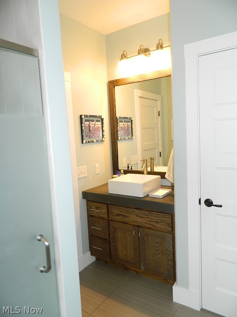 12464 Hotchkiss Road Burton, OH 44021 - Photo 17 of 35 Note the Concrete Counters and Access to an Amazing First Floor Laundry/Mud Room!