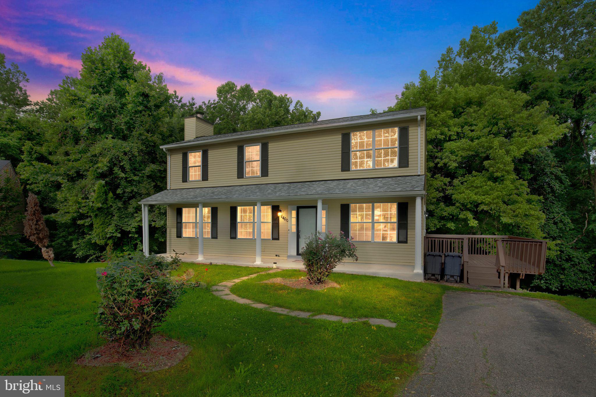 7400 Jaffrey Road Fort Washington, MD 20744 - Photo 1 of 31 a front view of a house with a yard and potted plants