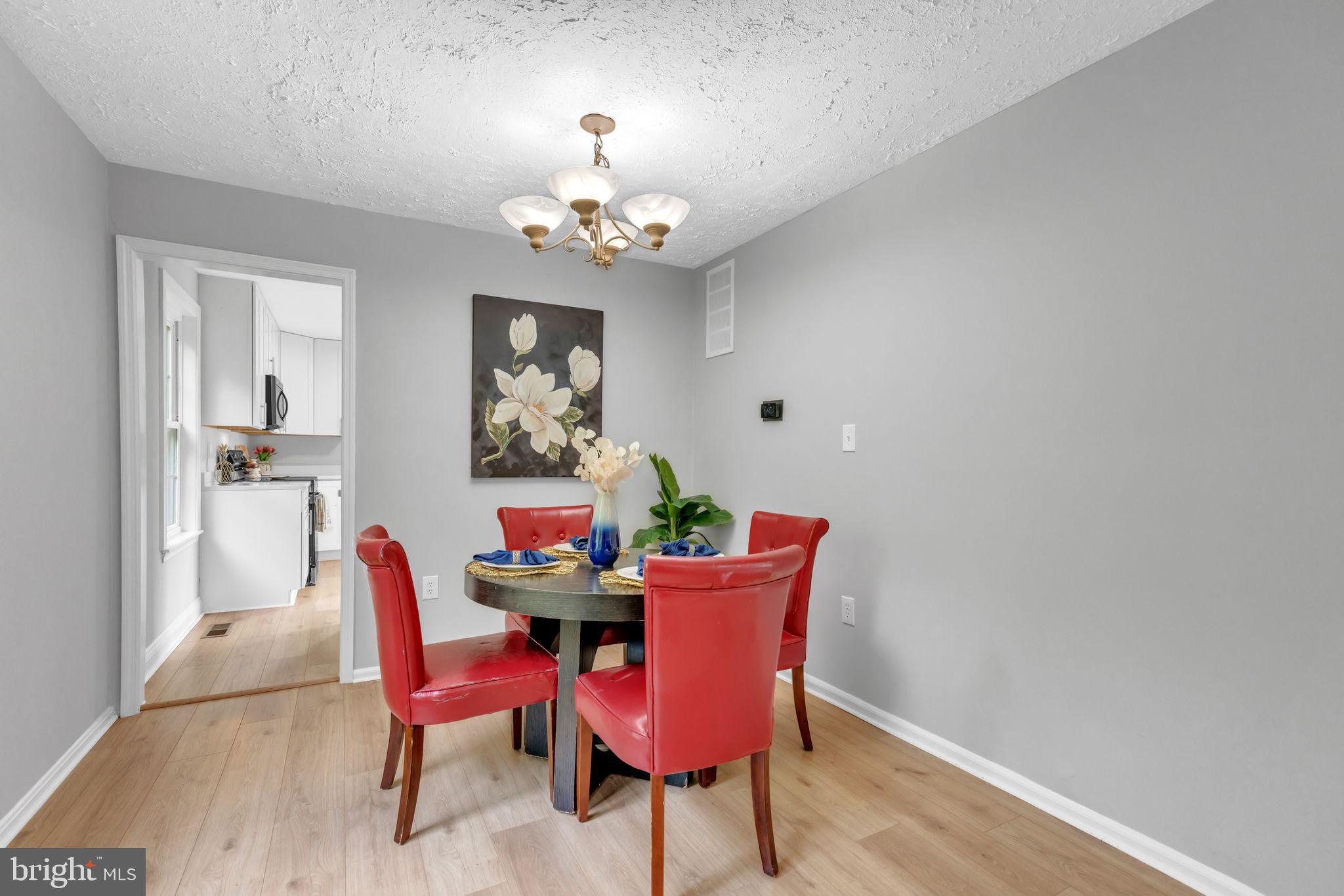 7400 Jaffrey Road Fort Washington, MD 20744 - Photo 16 of 31 a view of a dining room with furniture and chandelier