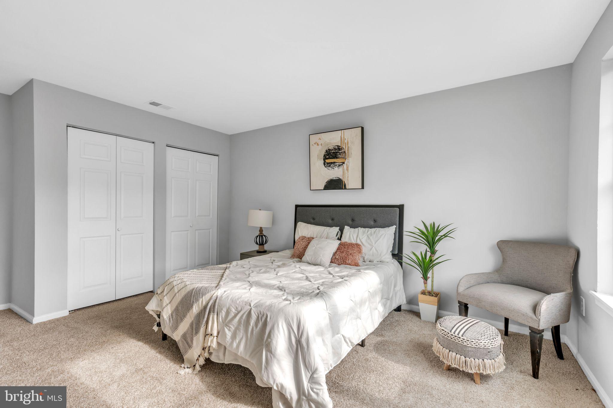 7400 Jaffrey Road Fort Washington, MD 20744 - Photo 18 of 31 a bedroom with a bed and a chair
