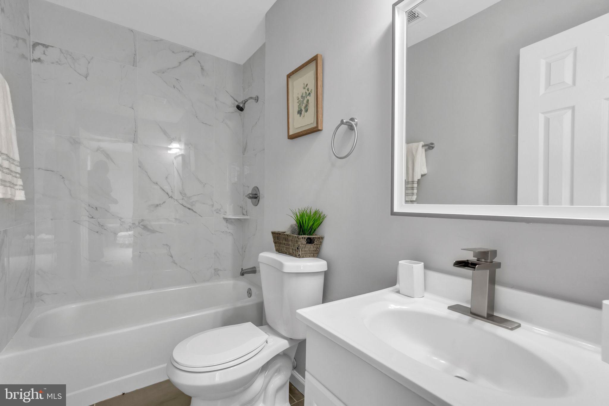 7400 Jaffrey Road Fort Washington, MD 20744 - Photo 21 of 31 a bathroom with a sink toilet and shower