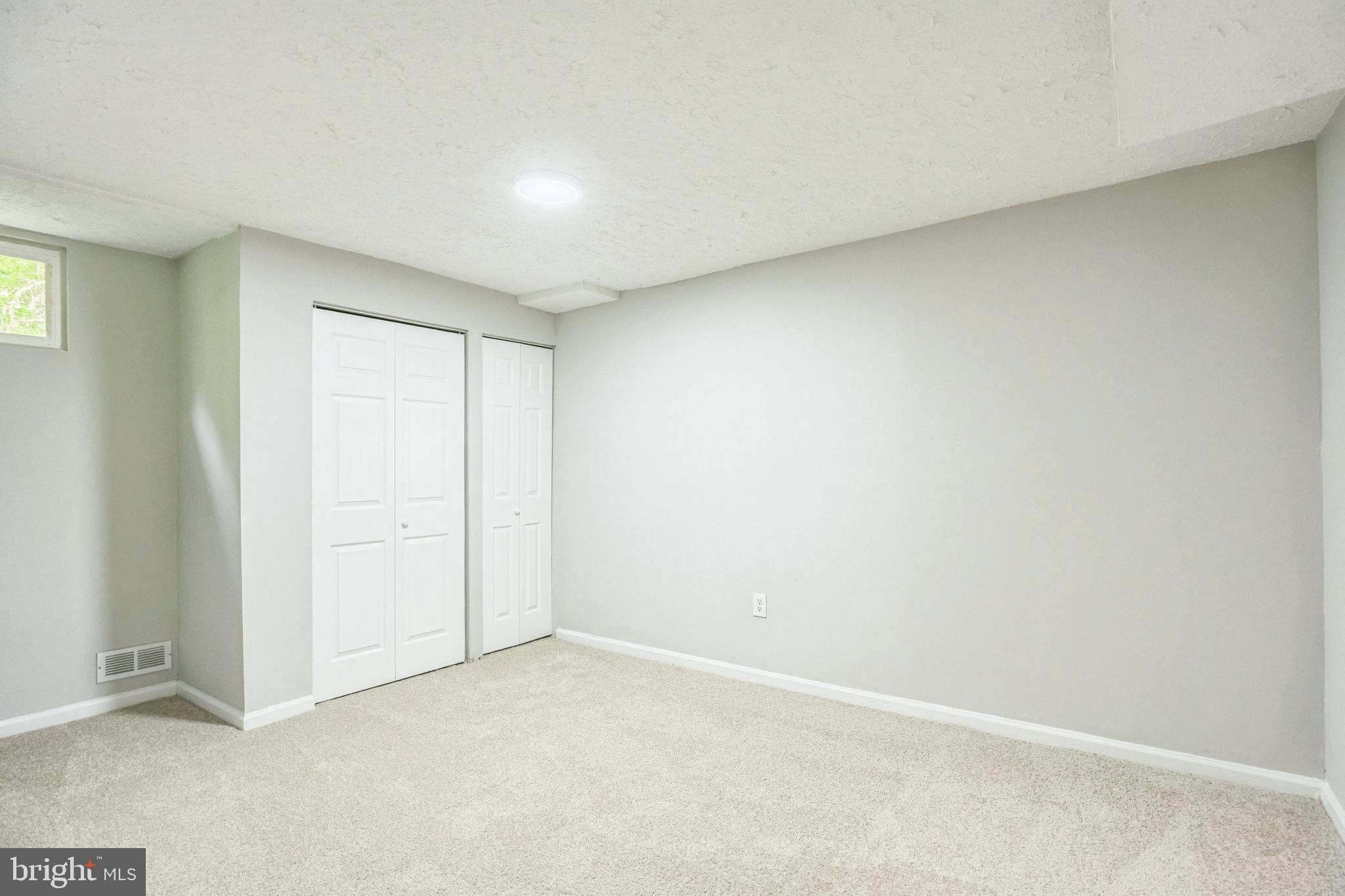 7400 Jaffrey Road Fort Washington, MD 20744 - Photo 23 of 31 an empty room with windows & cabinet