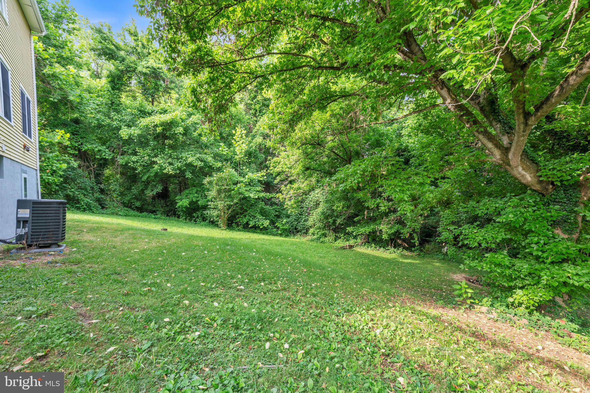 7400 Jaffrey Road Fort Washington, MD 20744 - Photo 3 of 31 a view of a backyard with a garden and entertaining space