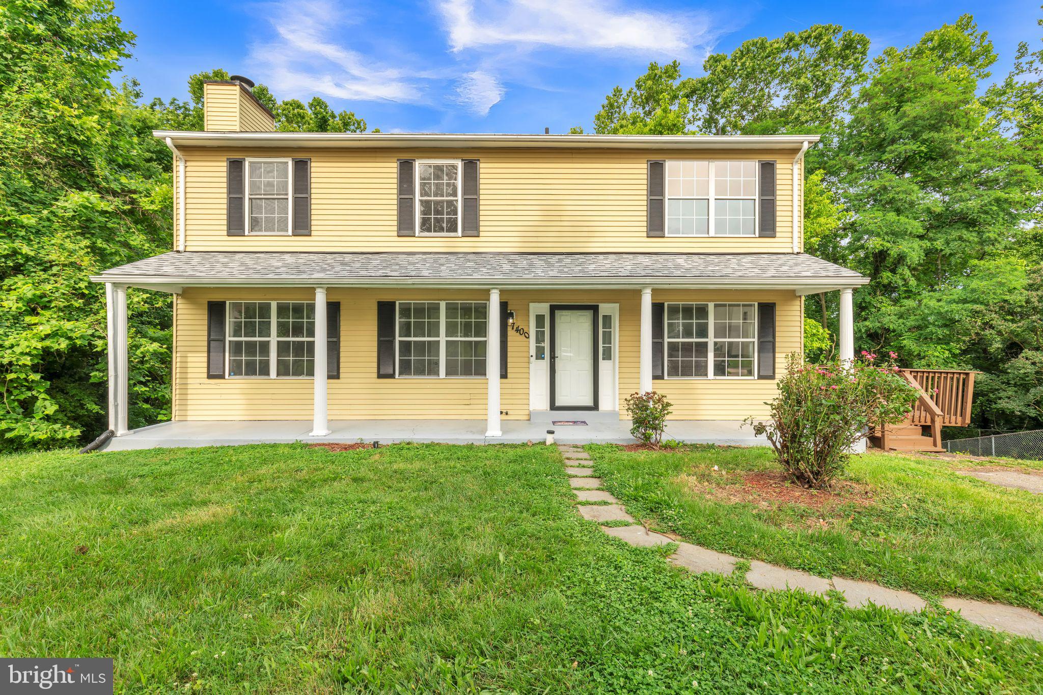 7400 Jaffrey Road Fort Washington, MD 20744 - Photo 5 of 31 a front view of a house with a yard