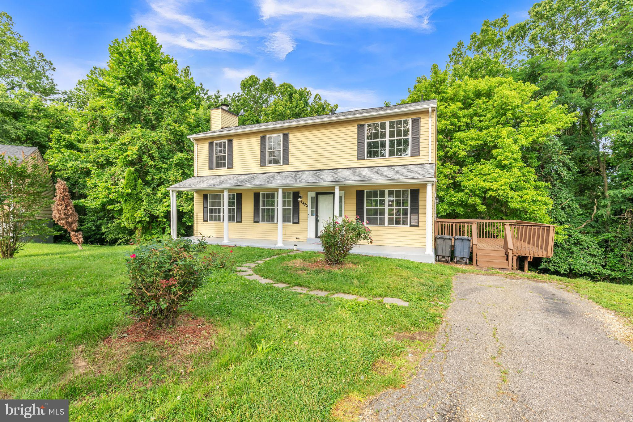 7400 Jaffrey Road Fort Washington, MD 20744 - Photo 7 of 31 a front view of a house with a yard